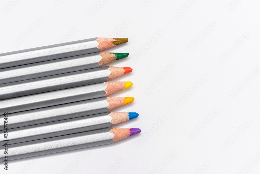 Fototapeta premium gray wooden pencils with colored rods on a white background