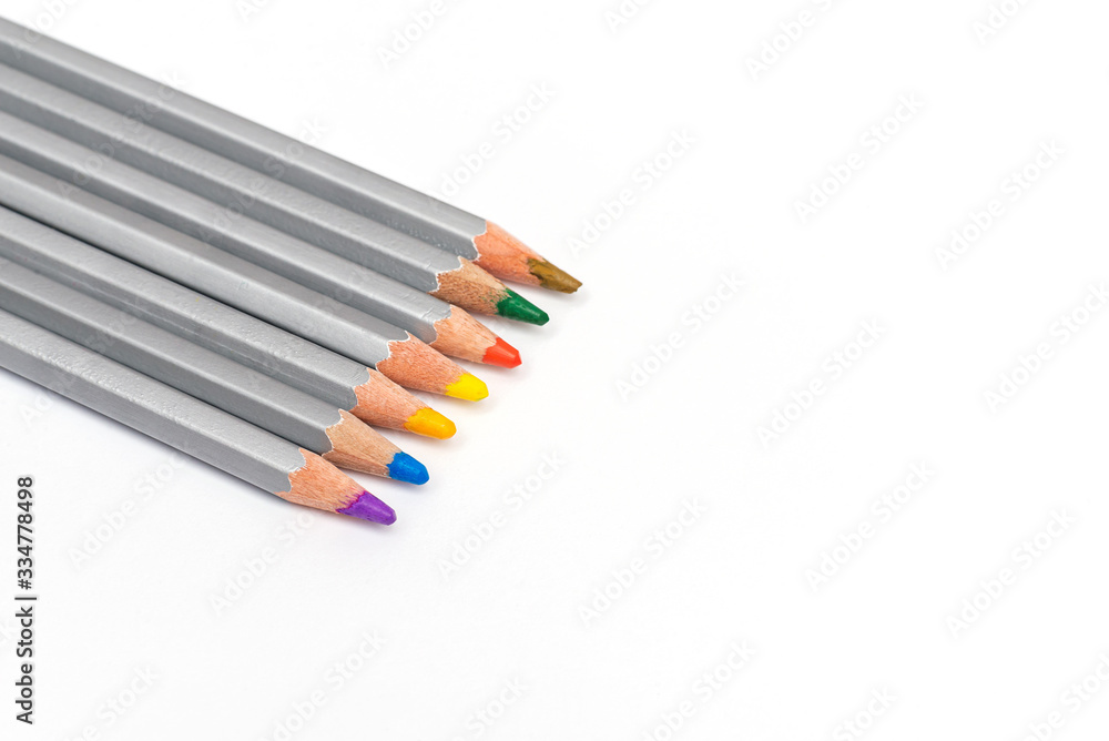 gray wooden pencils with colored rods on a white background gray wooden pencils with colored rods on a white background