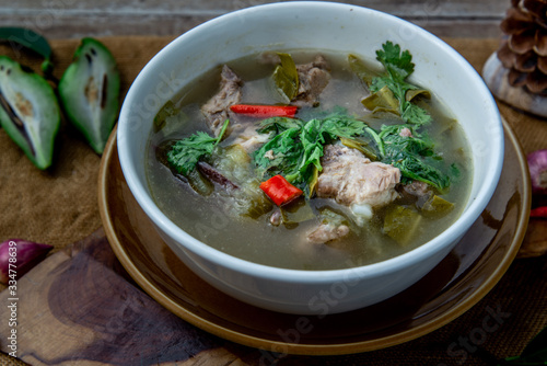 Pork spare rip Madan soup (Kra Dook Moo Tom Ma-Dun) in a white bowl, Traditional Thai food.