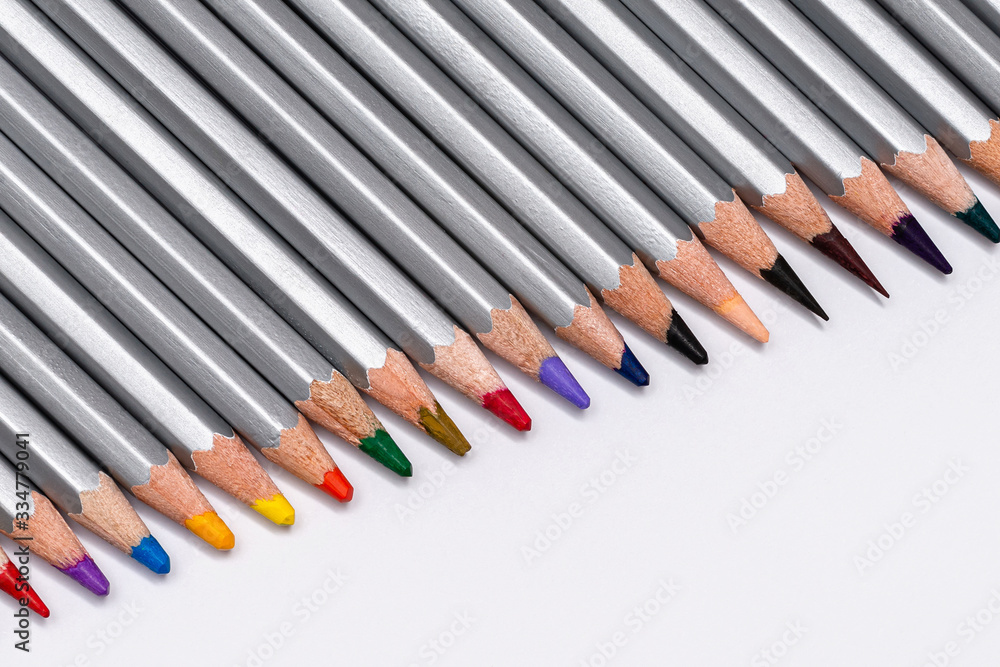 gray wooden pencils with colored rods on a white background gray wooden pencils with colored rods on a white background