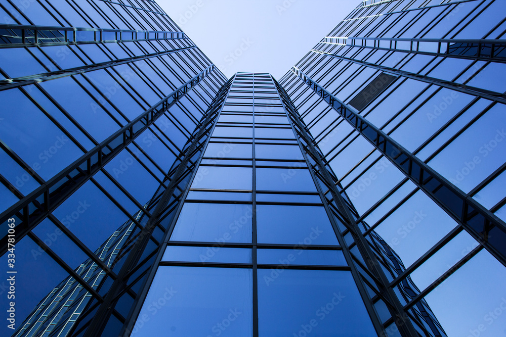 Obraz premium modern office building with reflection in windows of building