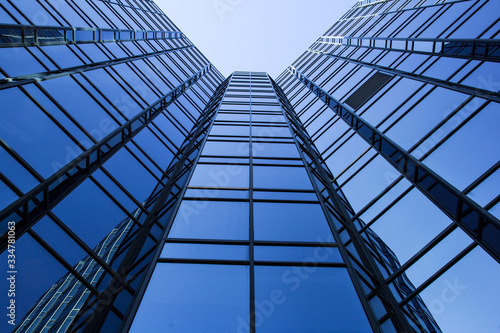 modern office building with reflection in windows of building