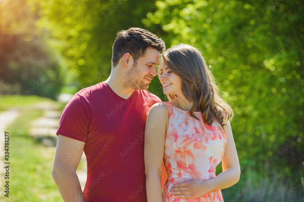 a lovely couple is enjoying sunny day outside a lovely couple is enjoying sunny day outside