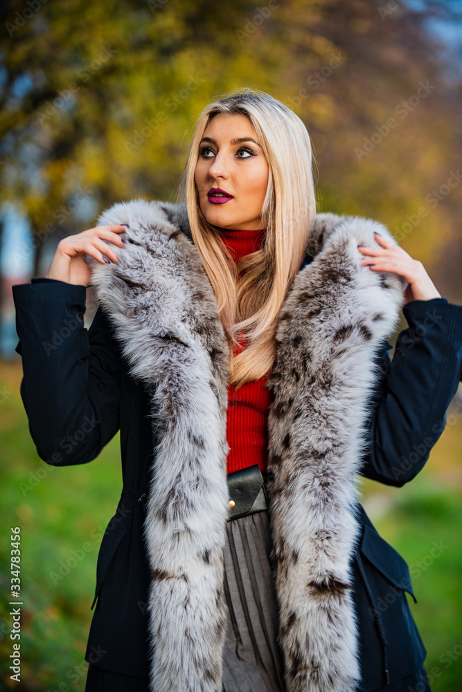 beauty and fashion. woman wear fur coat. trendy winter look. No Compromise on Comfort. Man-made fur is prone to shedding. fake fur from a reputable brand. elegant girl walk in autumn park beauty and fashion. woman wear fur coat. trendy winter look. No Compromise on Comfort. Man-made fur is prone to shedding. fake fur from a reputable brand. elegant girl walk in autumn park