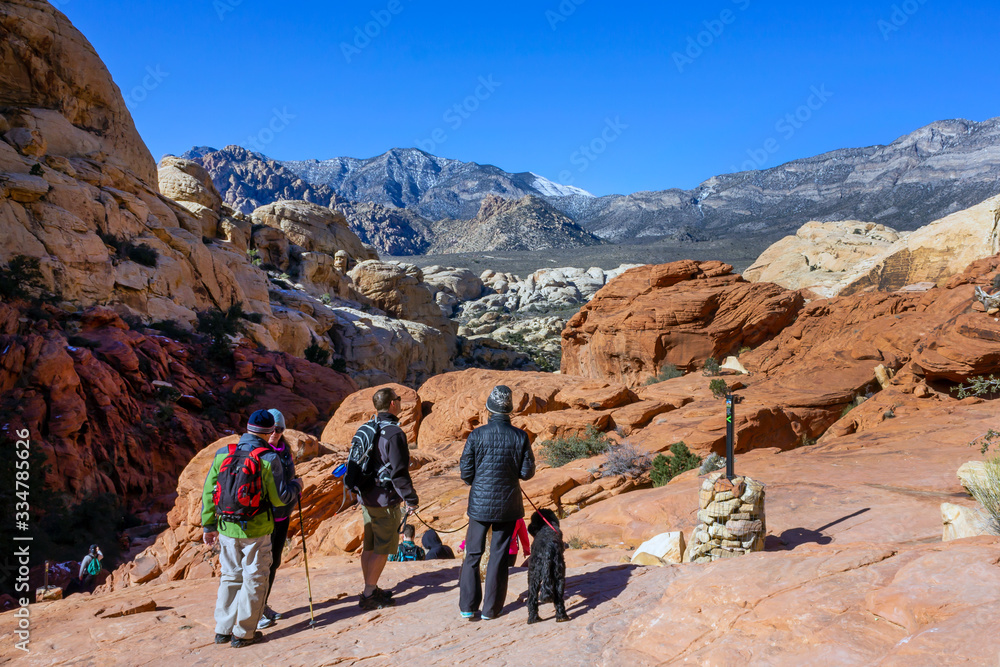 tourists visitors backpackers in red rock mountains landscape Red Rock Canyon National Conservation Area Nevada’s Mojave Desert