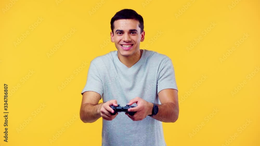 excited man with joystick isolated on yellow excited man with joystick isolated on yellow