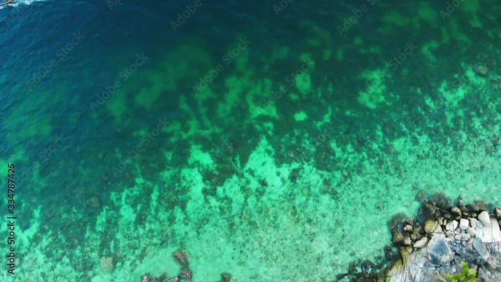 Aerial Drone View of a tropical island with lush jungle and turquoise water Aerial Drone View of a tropical island with lush jungle and turquoise water