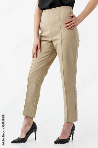 young girl in pastel trousers