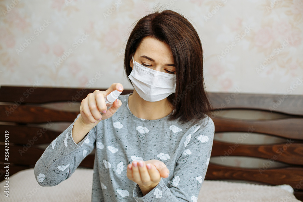 Hands desinfection. Safe work from home. Woman cleans her hand with a sanitizer. Hands desinfection. Safe work from home. Woman cleans her hand with a sanitizer.