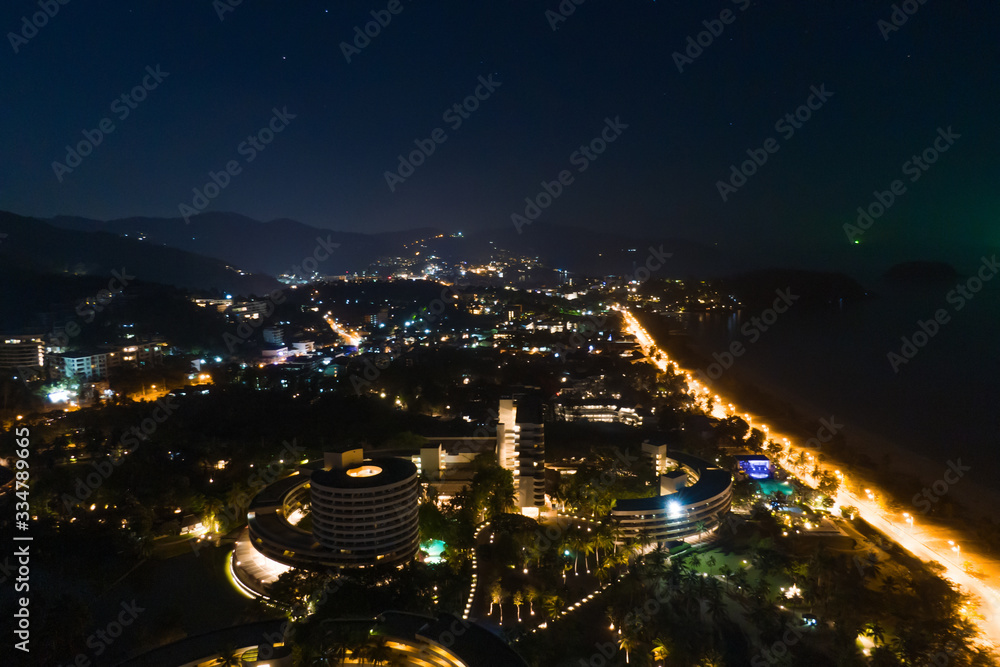 Aerial photography top see to karon beach in night time, phuket Thailand