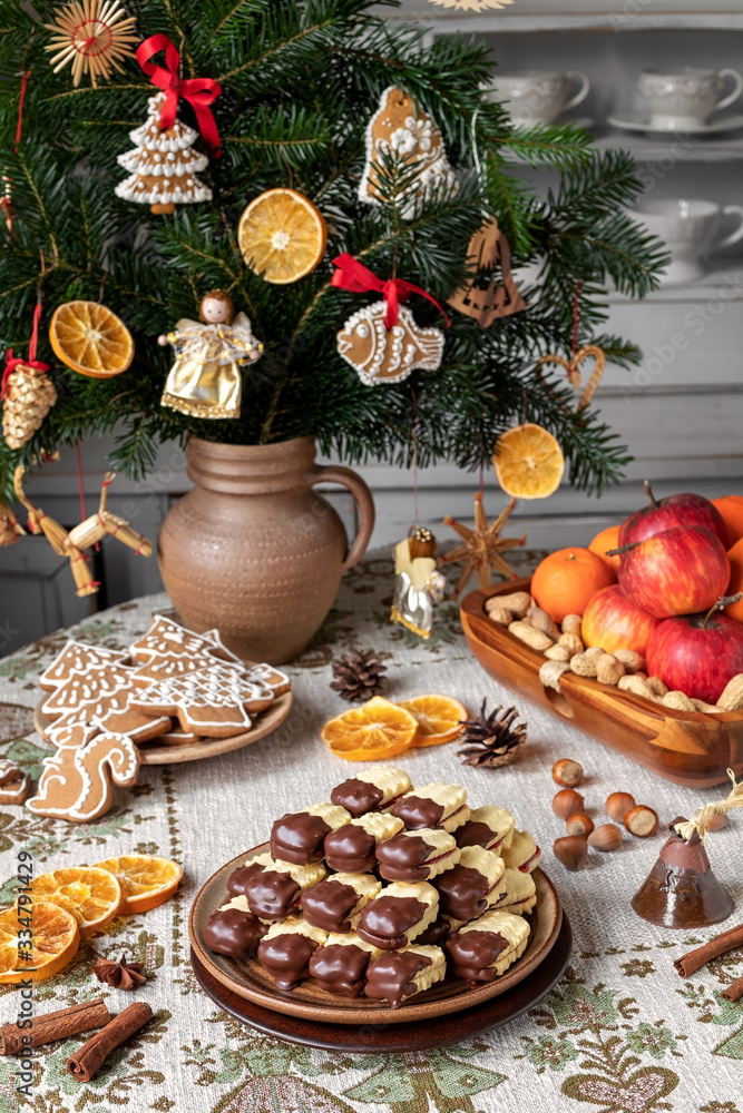 Christmas cookies filled with marmalade and dipped in chocolate Christmas cookies filled with marmalade and dipped in chocolate