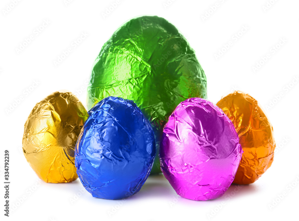 Sweet chocolate eggs on white background