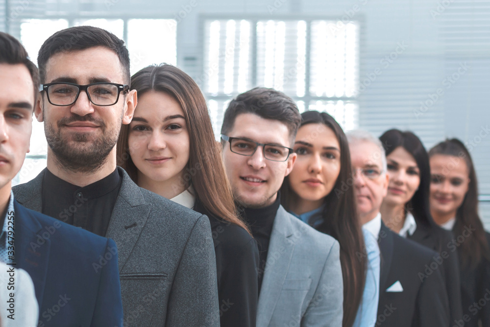 large group of young business people standing in a row. large group of young business people standing in a row.