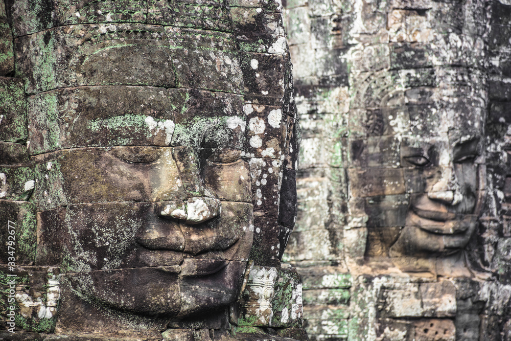 Giant stone faces at Bayon Temple, Angkor Wat, Cambodia.