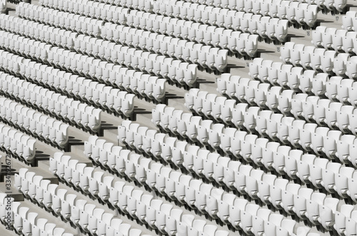 Cuadro en lienzo Rows of white empty plastic seats in a stadium