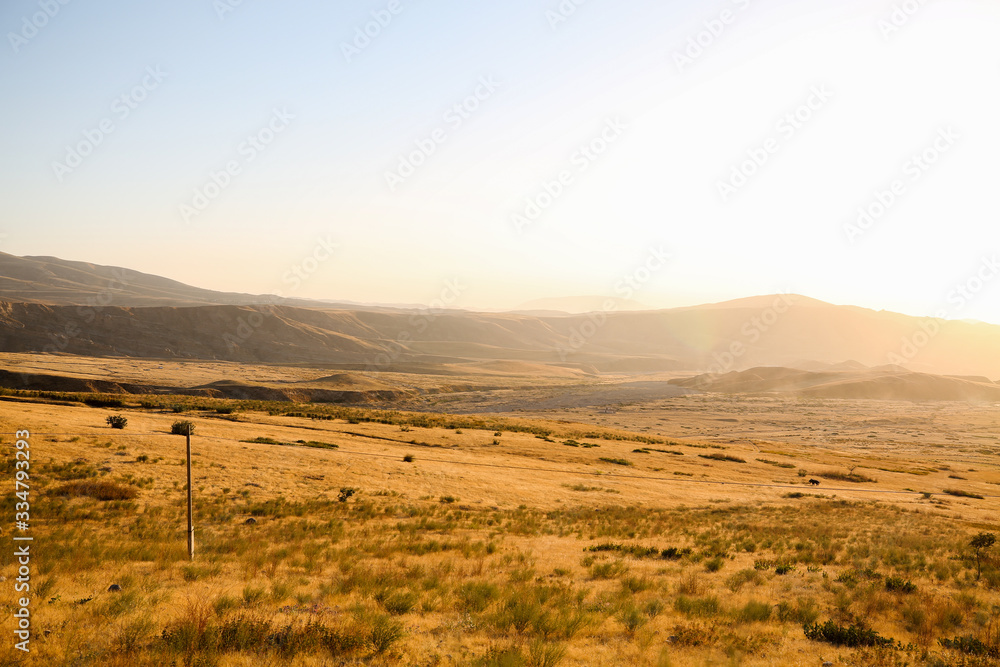 Fototapeta premium autumn valley in Tajikistan flooded with sunlight
