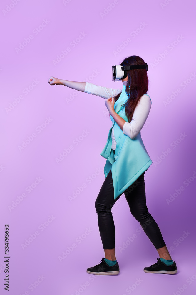 Woman is using virtual reality headset, playing game and fighting. Woman is using virtual reality headset, playing game and fighting.