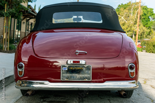 Fényképezés Classic 1951 Simca 8 Sport convertible car looks pretty from rear view with roof top up