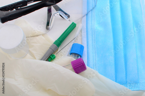 Surgical mask  gloves  test tubes and needle for virus clearance
