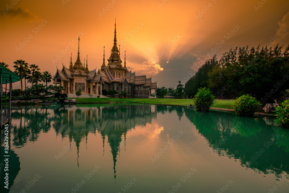 Obraz premium Wallpaper Wat Lan Boon Mahawihan Somdet Phra Buddhacharn(Wat Non Kum)is the beauty of the church that reflects the surface of the water, popular tourists come to make merit and take a public photo