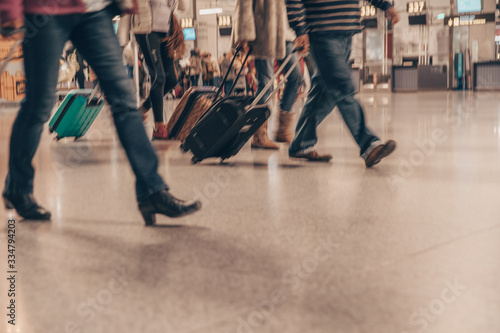People traveling with luggage, motion blur, copy space