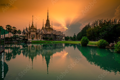 Wallpaper Wat Lan Boon Mahawihan Somdet Phra Buddhacharn(Wat Non Kum)is the beauty of the church that reflects the surface of the water, popular tourists come to make merit and take a public photo © bangprik