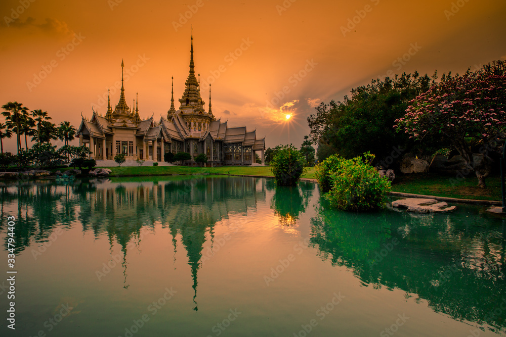Wallpaper Wat Lan Boon Mahawihan Somdet Phra Buddhacharn(Wat Non Kum)is the beauty of the church that reflects the surface of the water, popular tourists come to make merit and take a public photo