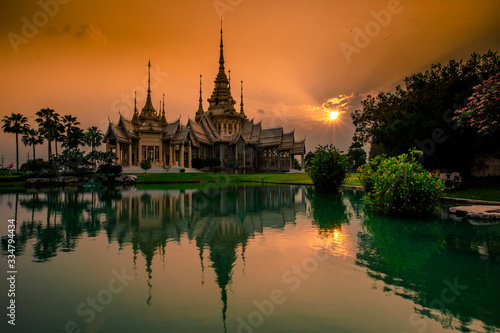 Wallpaper Wat Lan Boon Mahawihan Somdet Phra Buddhacharn(Wat Non Kum)is the beauty of the church that reflects the surface of the water, popular tourists come to make merit and take a public photo © bangprik