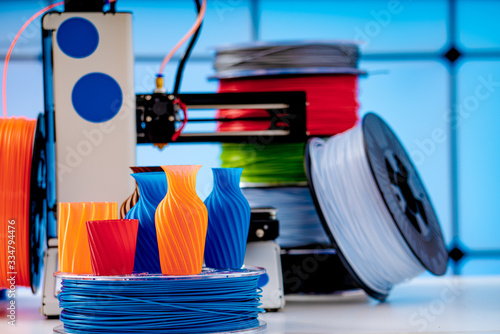 Bild auf Leinwand 3D Printer Plastic filament for 3D printer and printed products in the interior