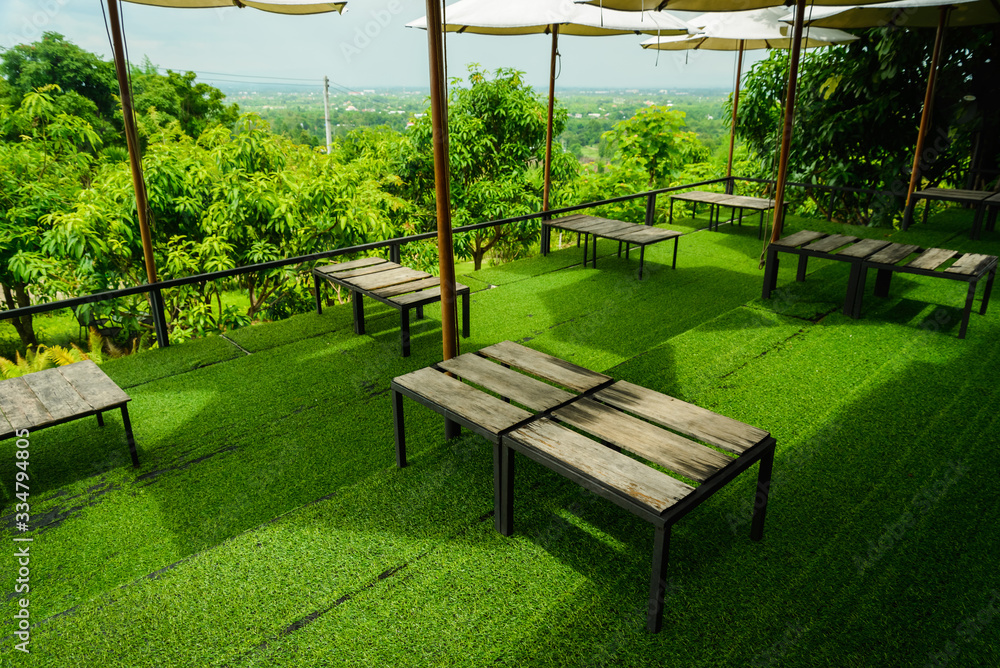 Wood table on artificial grass
