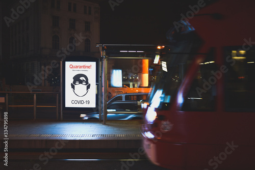 Photography Social outdoor advertising on stop in night  - Quarantine and mask mode in conne