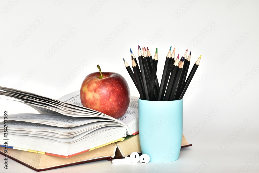 Set for the student. Back to school supplies.books and blacboard on white background. The concept of education copy spase Set for the student. Back to school supplies.books and blacboard on white background. The concept of education copy spase