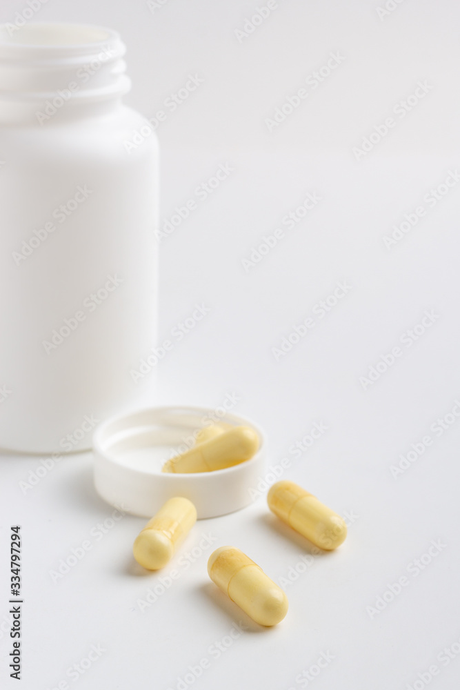 pills and bottle isolated on white background pills and bottle isolated on white background