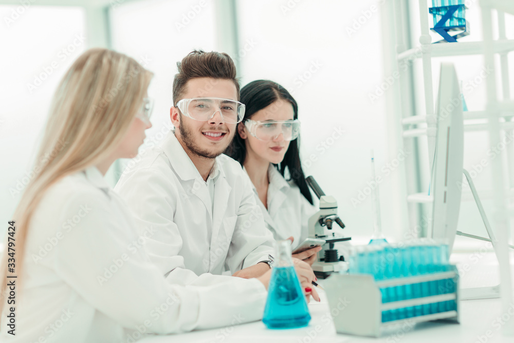 Fototapeta premium close up.a team of scientists use a computer to check the data