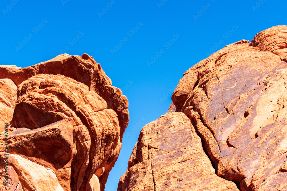 Amazing colors and shape of scenic aztec sandstone rock formations in valley of fire state park under beautiful blue sky