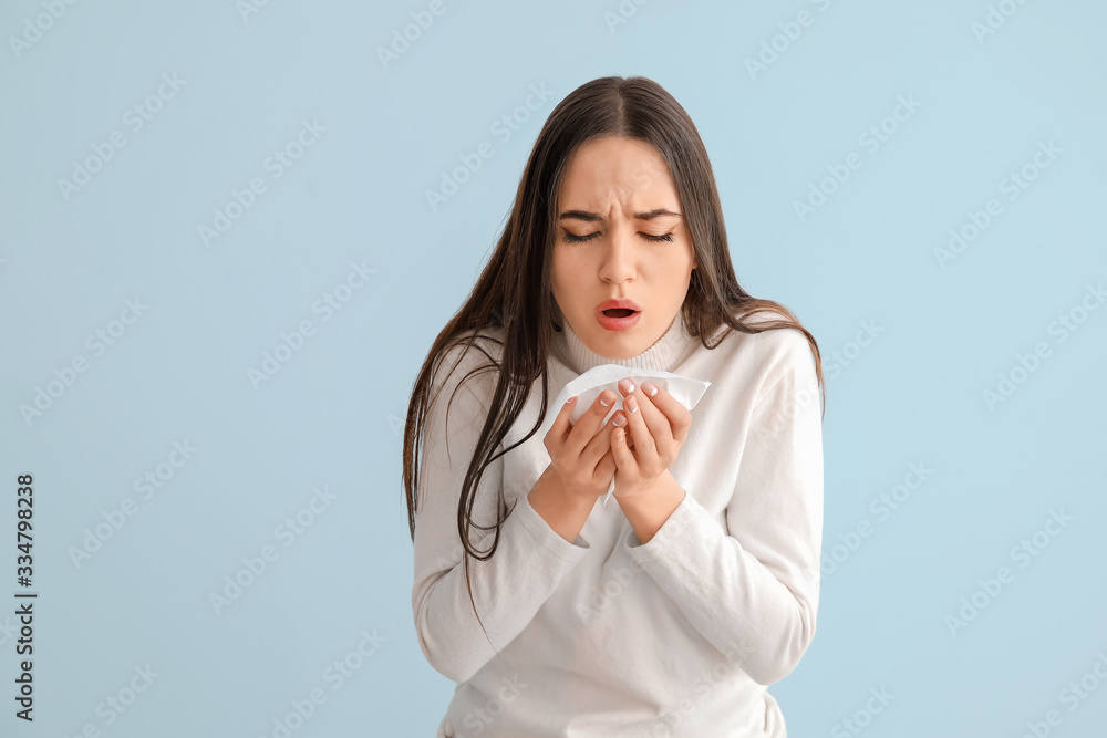 Coughing young woman on light background Coughing young woman on light background