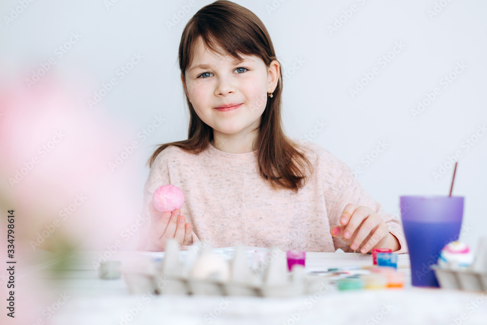 easter, family, holiday and child concept - close up of little girl coloring eggs for easter easter, family, holiday and child concept - close up of little girl coloring eggs for easter