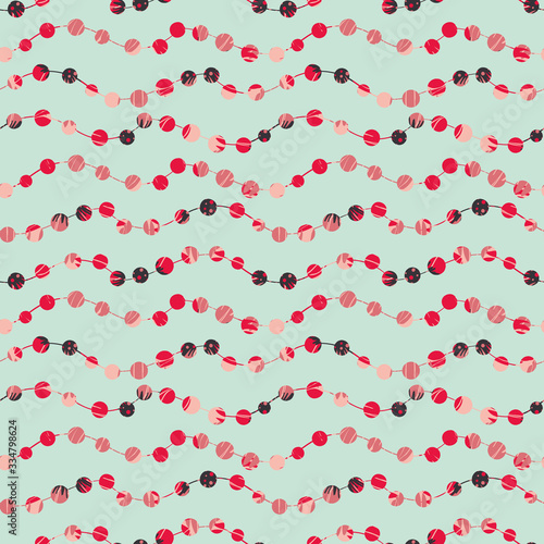 Strings of red colored beads on a light blue background. Jewellery surface print design. For fabrics, scrapbook paper, gift wrap, and packaging.