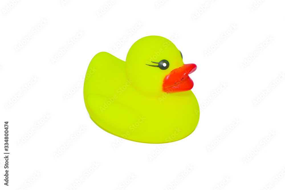 Fototapeta premium Yellow color miniature rubber toy of a duck isolated on a white background