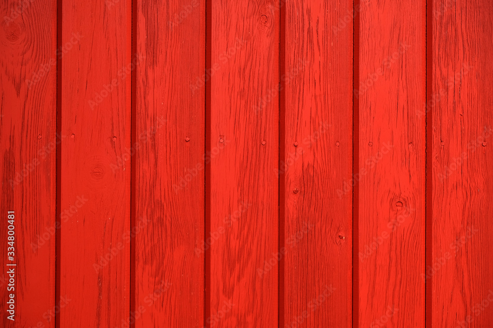 Old wooden background painted with red paint with a texture of cracks and scratches. Red background Old wooden background painted with red paint with a texture of cracks and scratches. Red background