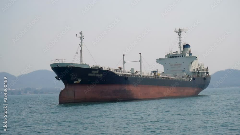 Large Oil Tanker Ship Seen From Moving Boat Large Oil Tanker Ship Seen From Moving Boat