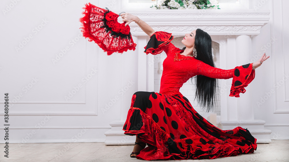 beautiful flamenco dancers performing a fiery dance - obrazy, fototapety, plakaty 