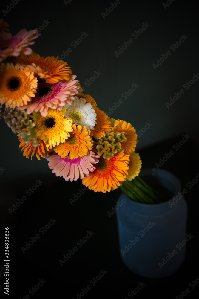 Fototapeta premium flowerdesign with gerbera flowers in shades of orange, yellow and pink 
