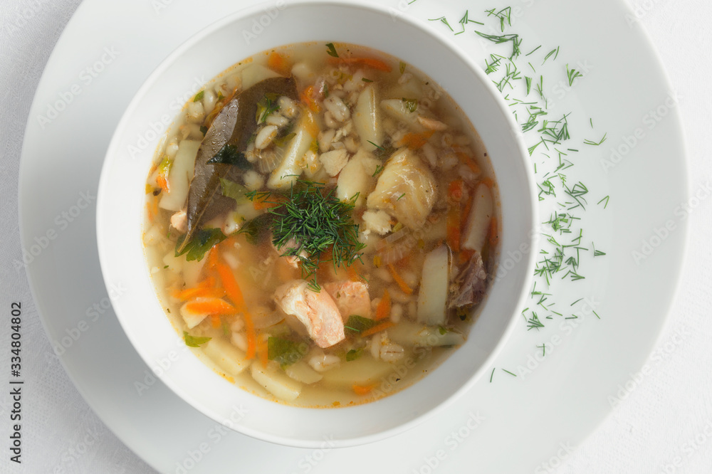salmon and cod ukha with potato, carrot, onion, and pearl barley decorated with dill salmon and cod ukha with potato, carrot, onion, and pearl barley decorated with dill