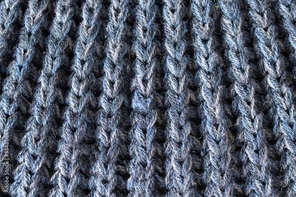 Crochet pattern, a close-up of a simple blue knitting pattern for background Crochet pattern, a close-up of a simple blue knitting pattern for background