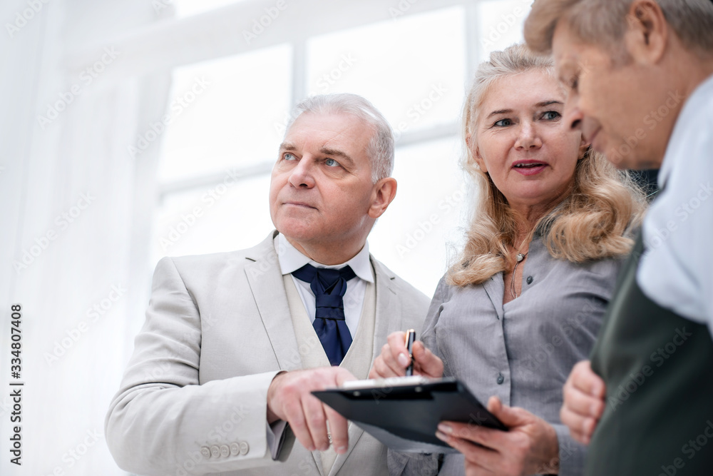 close up. group of employees discussing current tasks close up. group of employees discussing current tasks