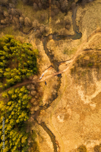 Aerial of winding stream river from above