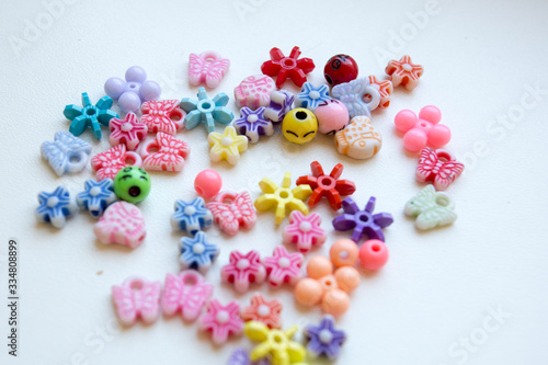 Scattered multi-colored ornaments on a white background