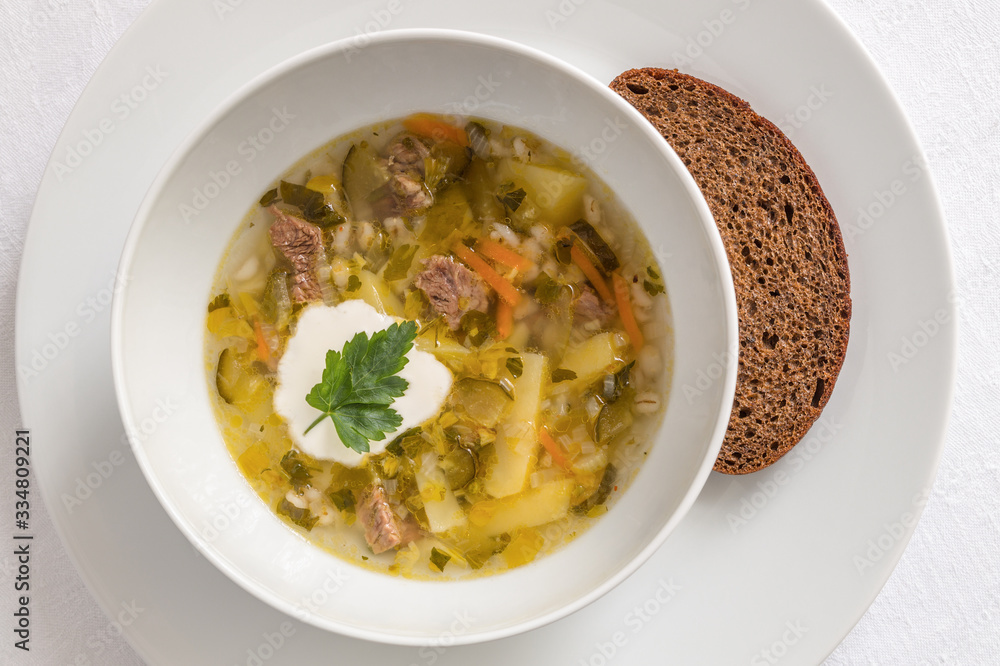 vegetable soup with meat served with bread and sour cream vegetable soup with meat served with bread and sour cream