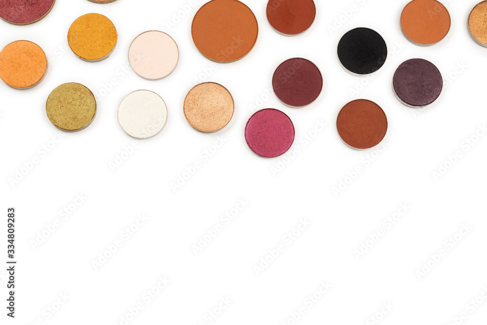 Round multicolored make up eyeshadows isolated on white.